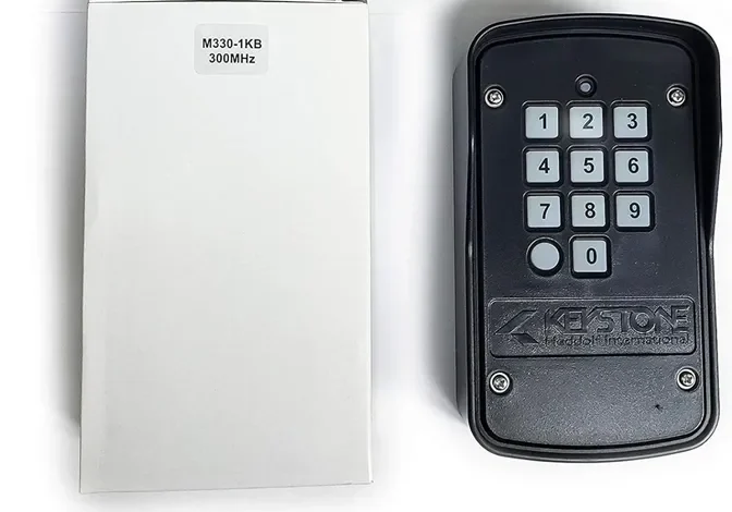 Keypad with box labeled M330-1KB 300MHz.
