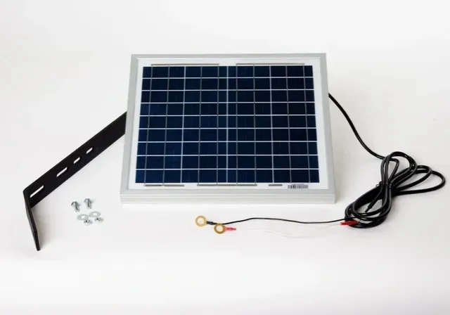 Small solar panel with mounting hardware.