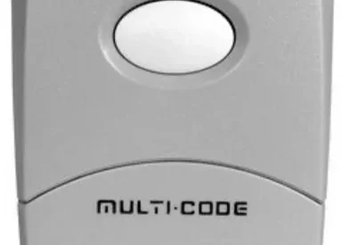 Gray garage door remote with single button.